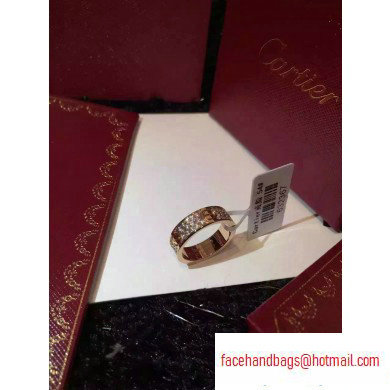 Cartier aurous gold love ring with diamonds