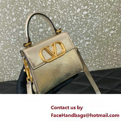 Valentino VSLING micro handbag in Calfskin Metallic Gold 2023