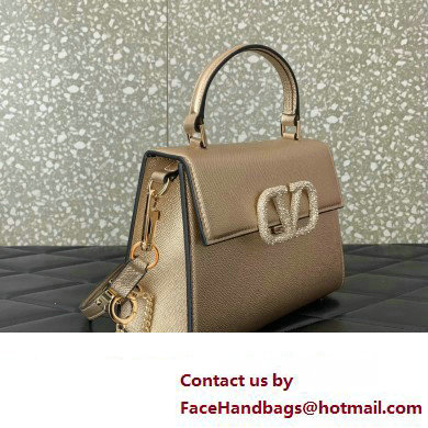 Valentino small VSLING Handbag in metallic Gold grainy calfskin with VLogo Signature crystals 2024