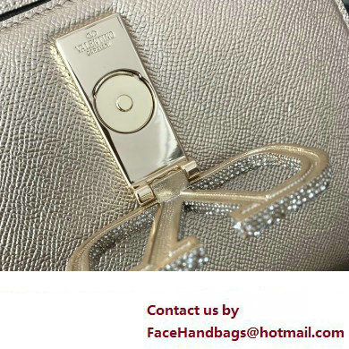 Valentino small VSLING Handbag in metallic Gold grainy calfskin with VLogo Signature crystals 2024