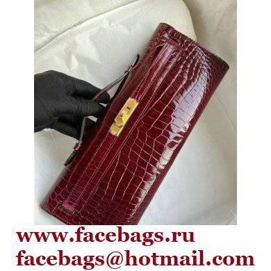 Hermes burgundy Kelly Cut 31cm porosus shiny Leather Clutch Gold/Silver Hardware